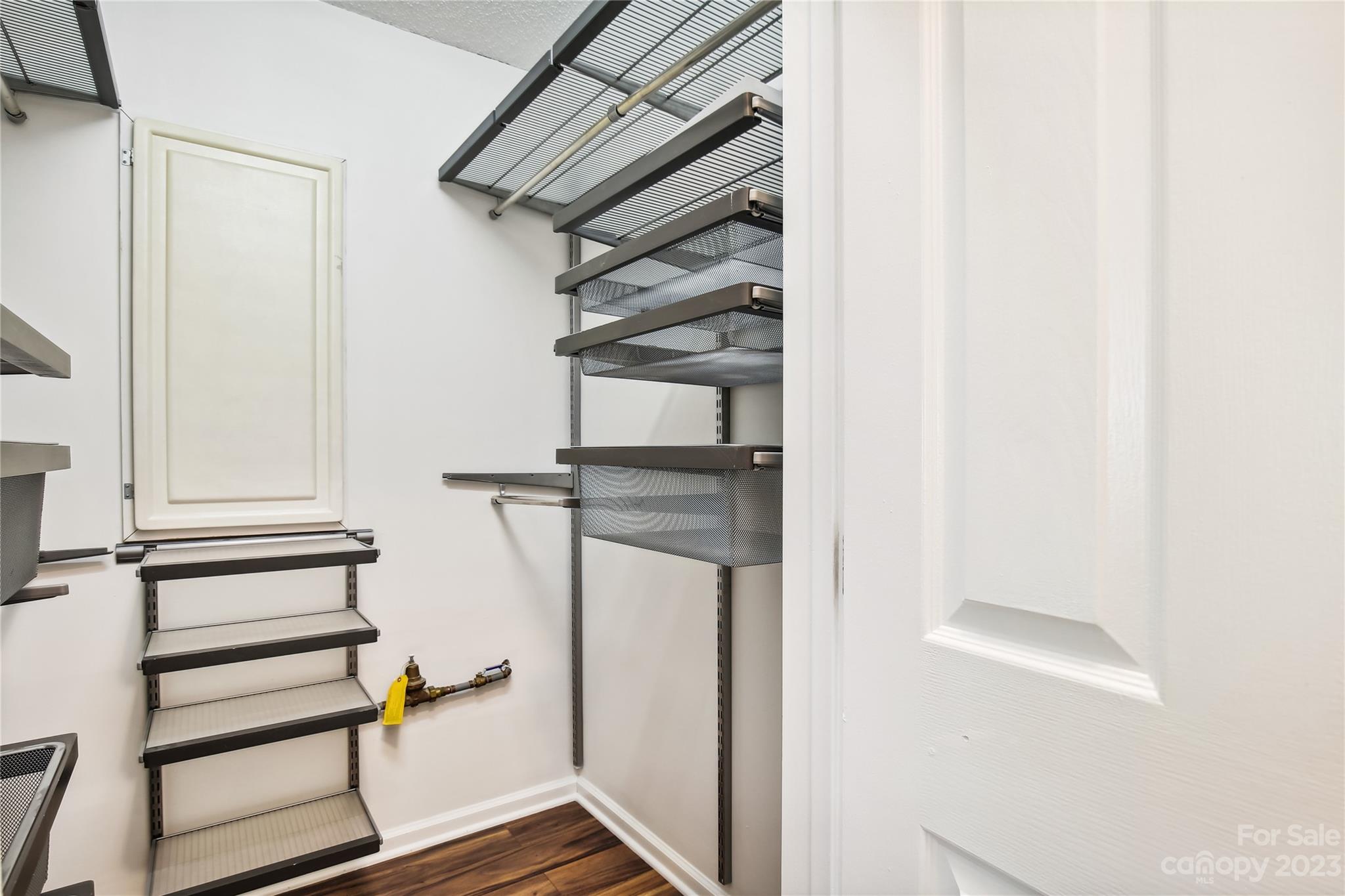 5007 Sharon Road, Unit E Charlotte, NC 28210 - Photo 22 of 30 a view of staircase with white walls and railing