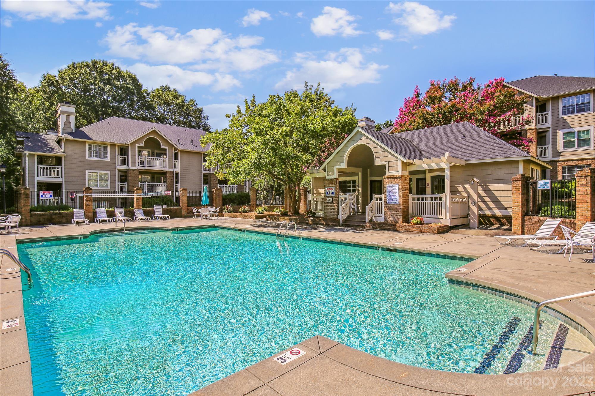 5007 Sharon Road, Unit E Charlotte, NC 28210 - Photo 29 of 30 a view of a house with a big yard
