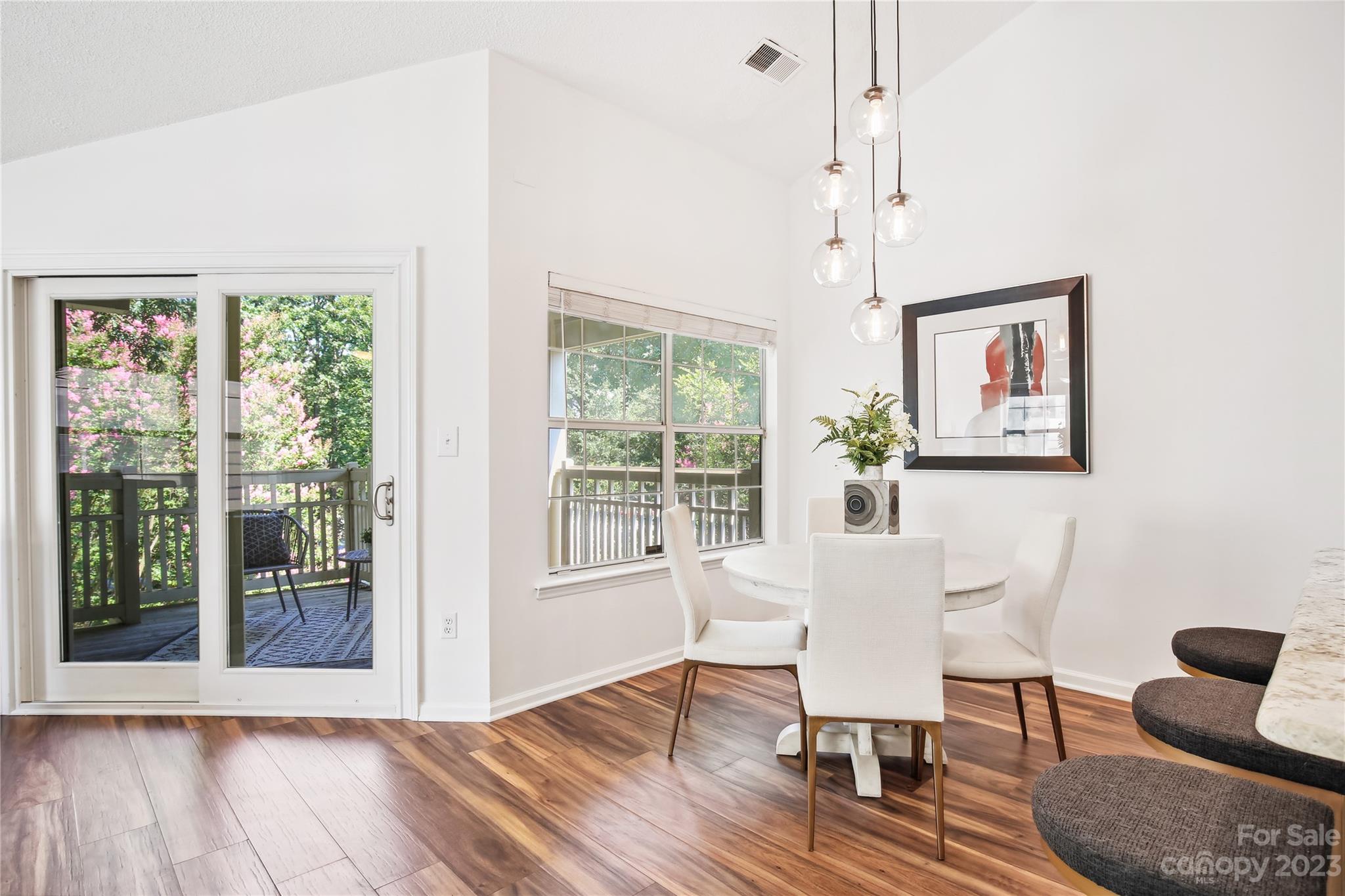 5007 Sharon Road, Unit E Charlotte, NC 28210 - Photo 10 of 30 a dining room with furniture and wooden floor