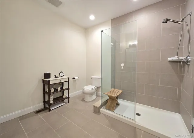 a spacious bathroom with a double vanity sink and a mirror