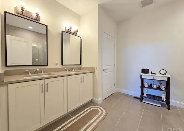 a spacious bedroom with a bed and window