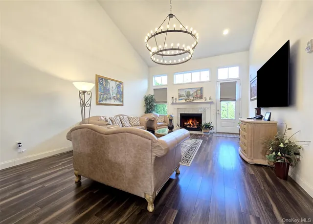 a living room with furniture fireplace and flat screen tv