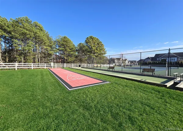 a view of a field and basketball court