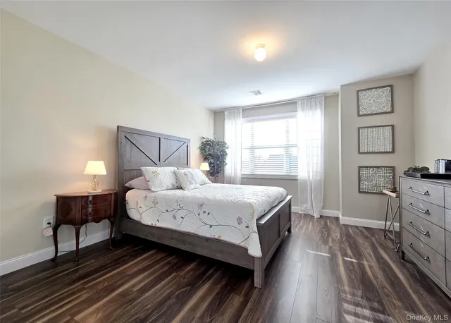 a bed room with a bed and a window