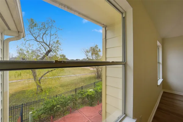 a bathroom with a tub a sink and mirror