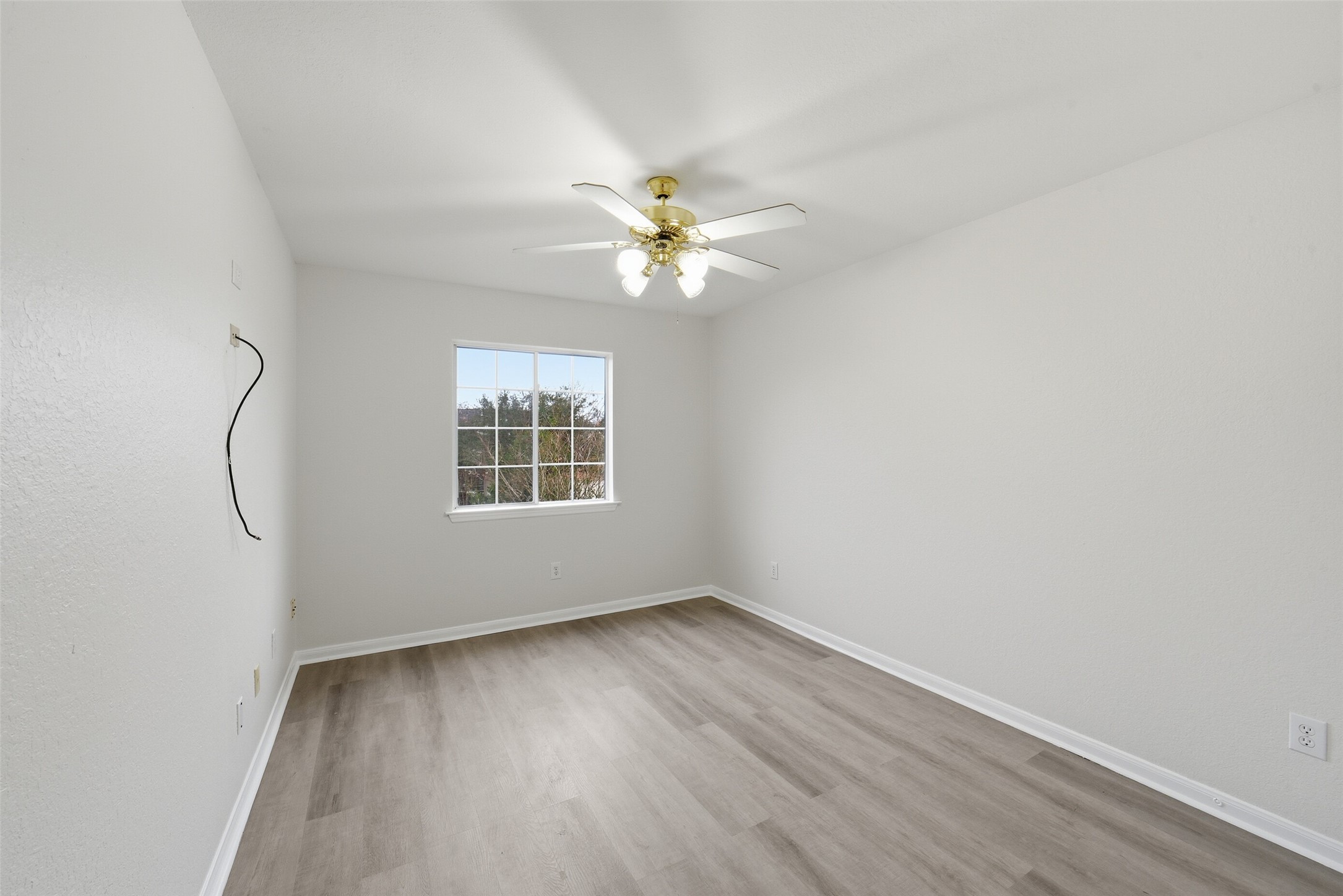 2110 Ridge Wood Lane Sugar Land, TX 77479 - Photo 21 of 26 wooden floor in an empty room with a window