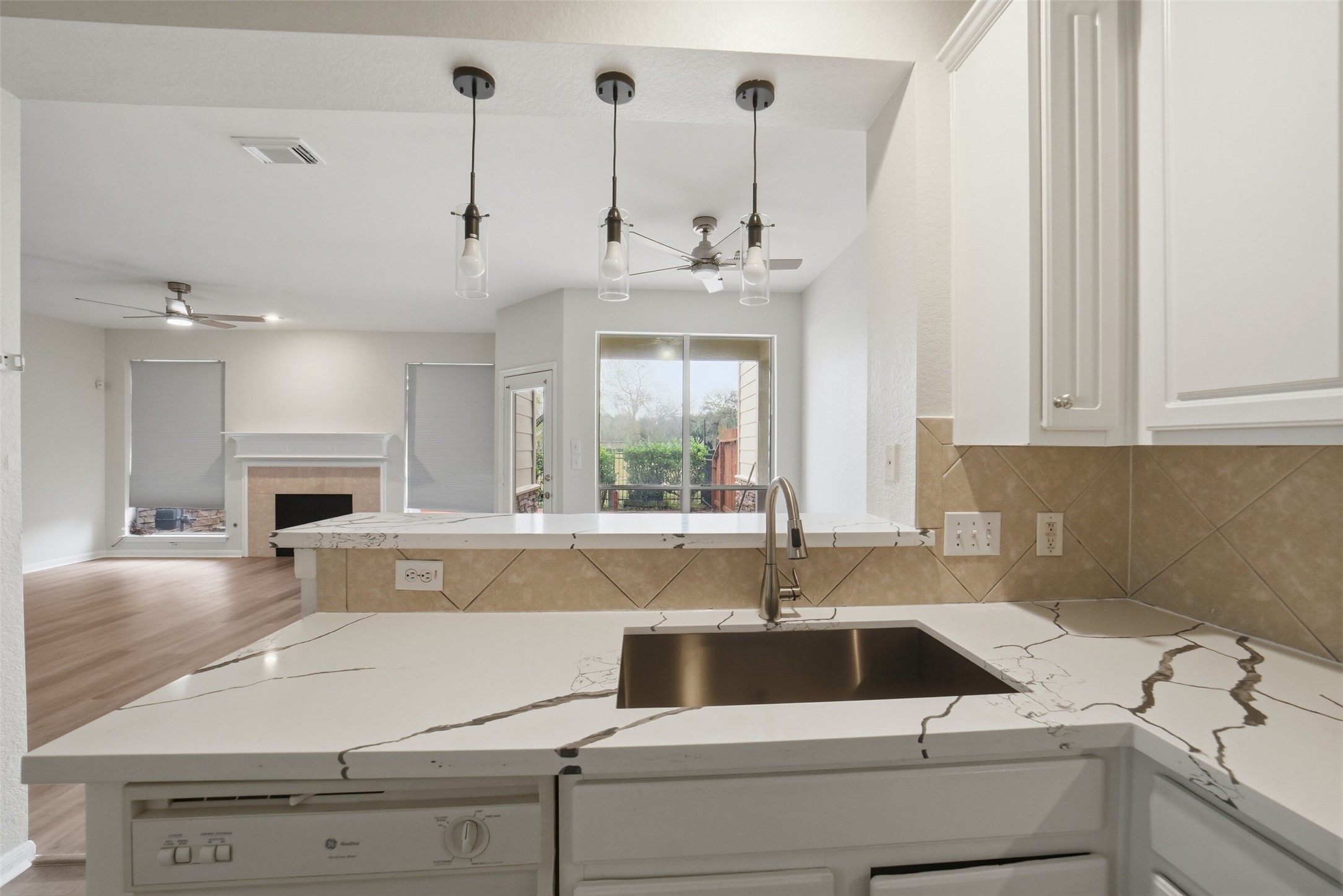2110 Ridge Wood Lane Sugar Land, TX 77479 - Photo 10 of 26 a kitchen with a sink cabinets and window