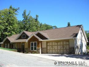 132 Sunny Ridge Road Hendersonville, NC 28739 - Photo 1 of 12 a view of a house with a yard