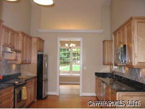 132 Sunny Ridge Road Hendersonville, NC 28739 - Photo 6 of 12 a kitchen with stainless steel appliances granite countertop a refrigerator and a stove