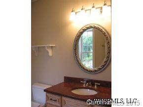 132 Sunny Ridge Road Hendersonville, NC 28739 - Photo 8 of 12 a bathroom with a sink and a mirror