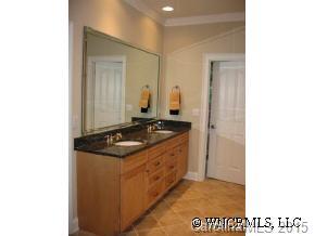 132 Sunny Ridge Road Hendersonville, NC 28739 - Photo 10 of 12 a bathroom with a sink and a mirror