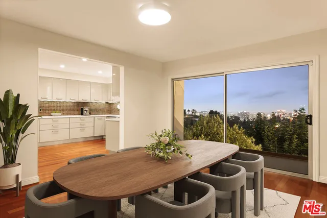 a view of a dining room with furniture window and outside view