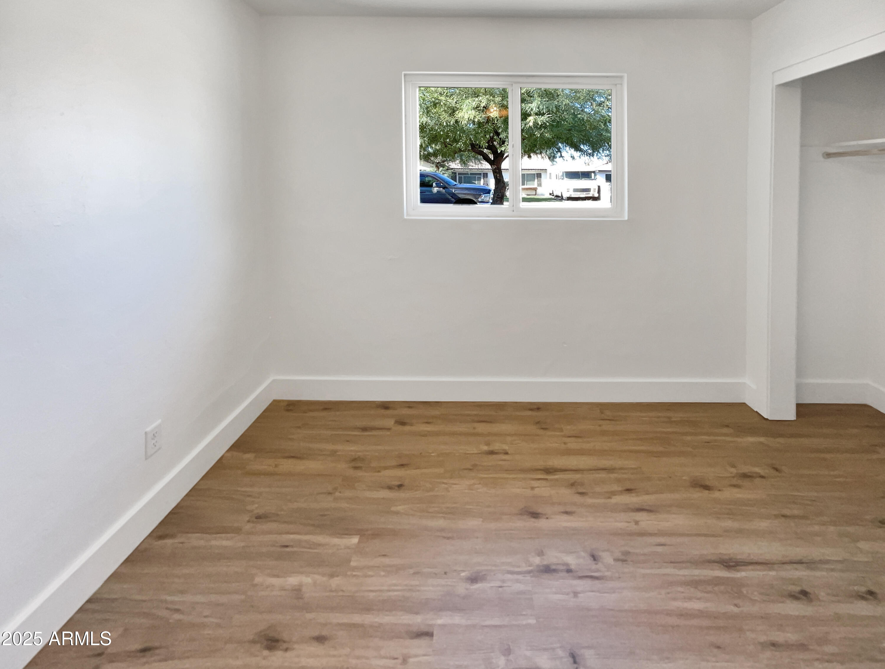 7231 North 23rd Avenue Phoenix, AZ 85021 - Photo 23 of 28 a view of a room with wooden floor and window