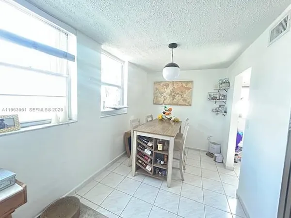 a view of kitchen with furniture and window