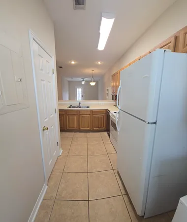 a kitchen with stainless steel appliances a refrigerator and a sink