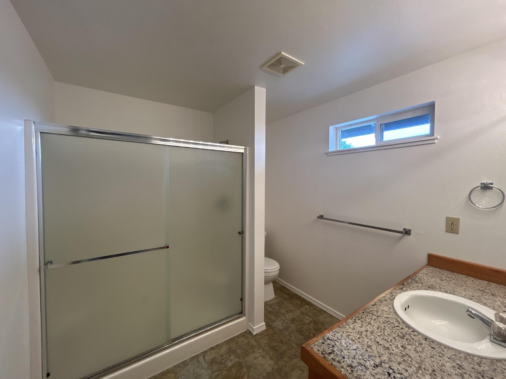 2211 Southwest Quartz Avenue Redmond, OR 97756 - Photo 12 of 26 a bathroom with a sink toilet and shower