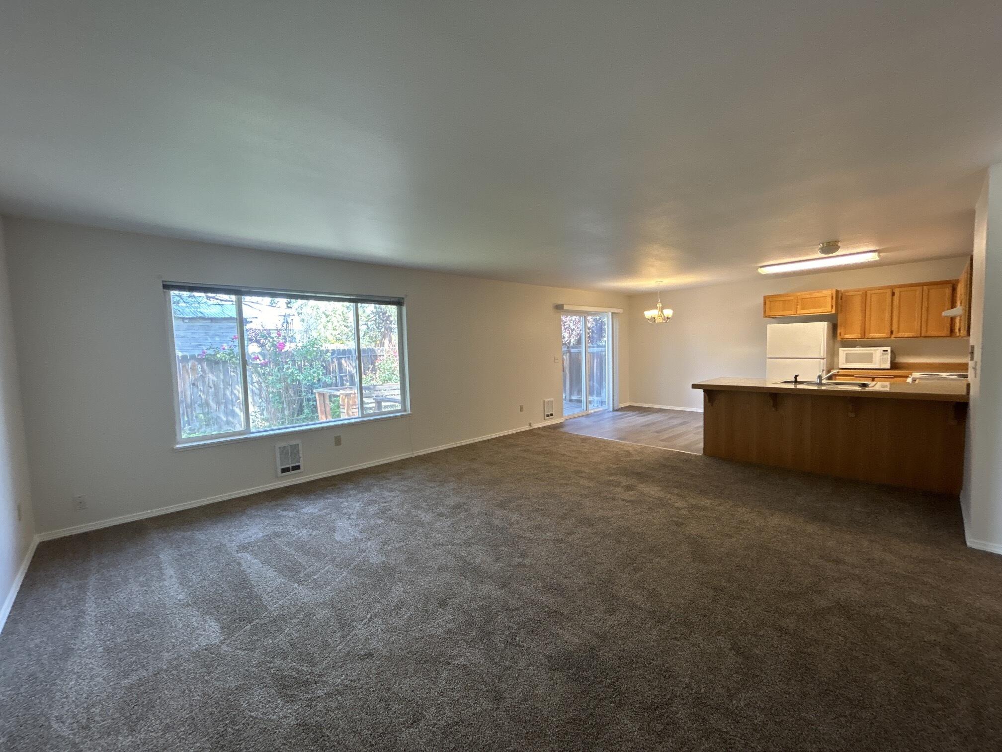 2211 Southwest Quartz Avenue Redmond, OR 97756 - Photo 3 of 26 an empty room with a window
