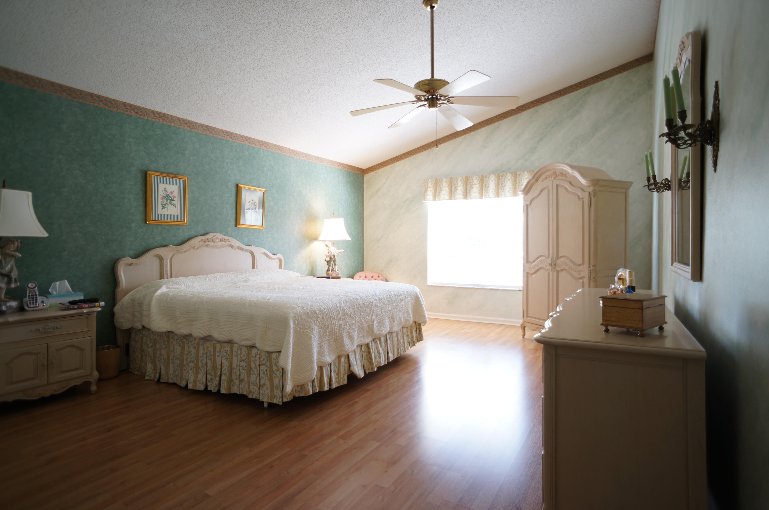 6291 Via Palladium Boca Raton, FL 33433 - Photo 8 of 16 a bedroom with a bed lamps and wooden floor