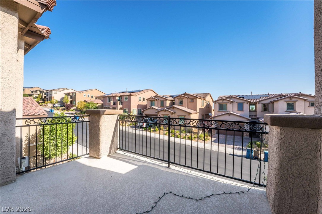 2787 Athens Ridge Drive Henderson, NV 89052 - Photo 19 of 31 Enjoy neighborhood views from this private balcony, perfect for morning coffee or evening relaxation.