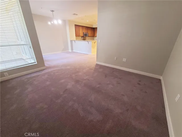 a view of room with a flat tv screen and a window