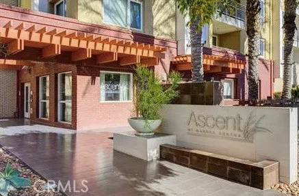 a living room with furniture wooden floor and a large window
