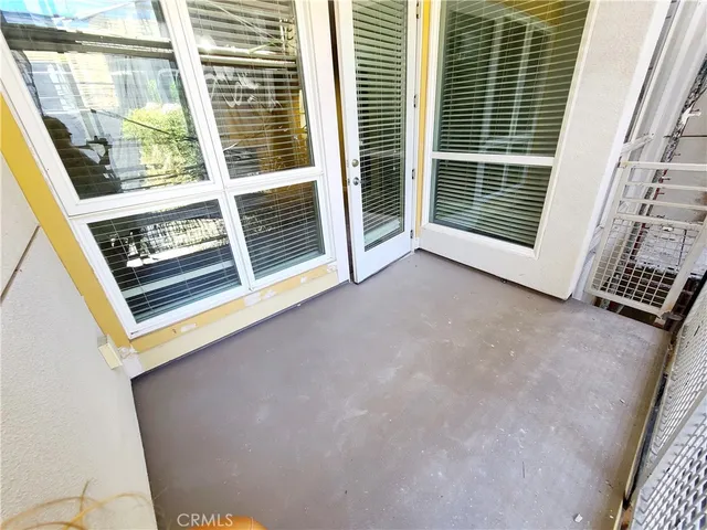 a room with gym equipment and windows