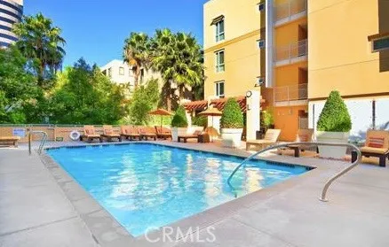 a room with a large window and furniture