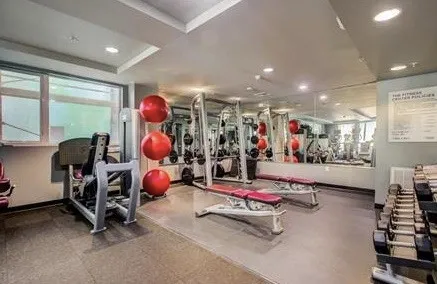 a view of a roof deck with couches and potted plants