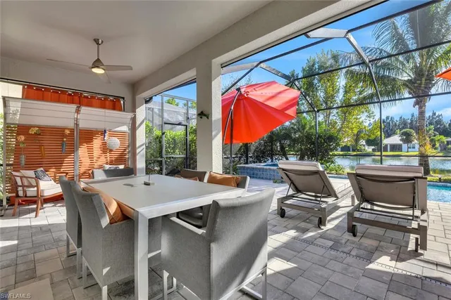 a view of a patio with a table and chairs
