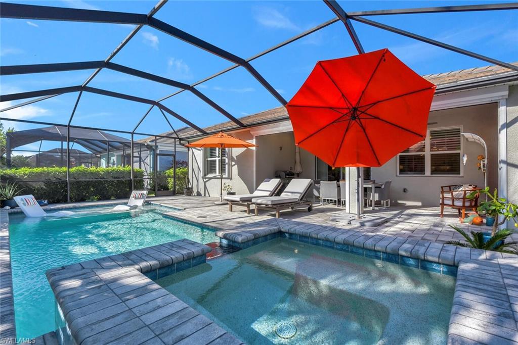 14662 Catamaran Place Naples, FL 34114 - Photo 29 of 44 a view of swimming pool with outdoor seating