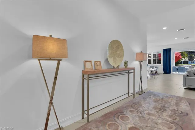 a view of living room with furniture and a flat screen tv