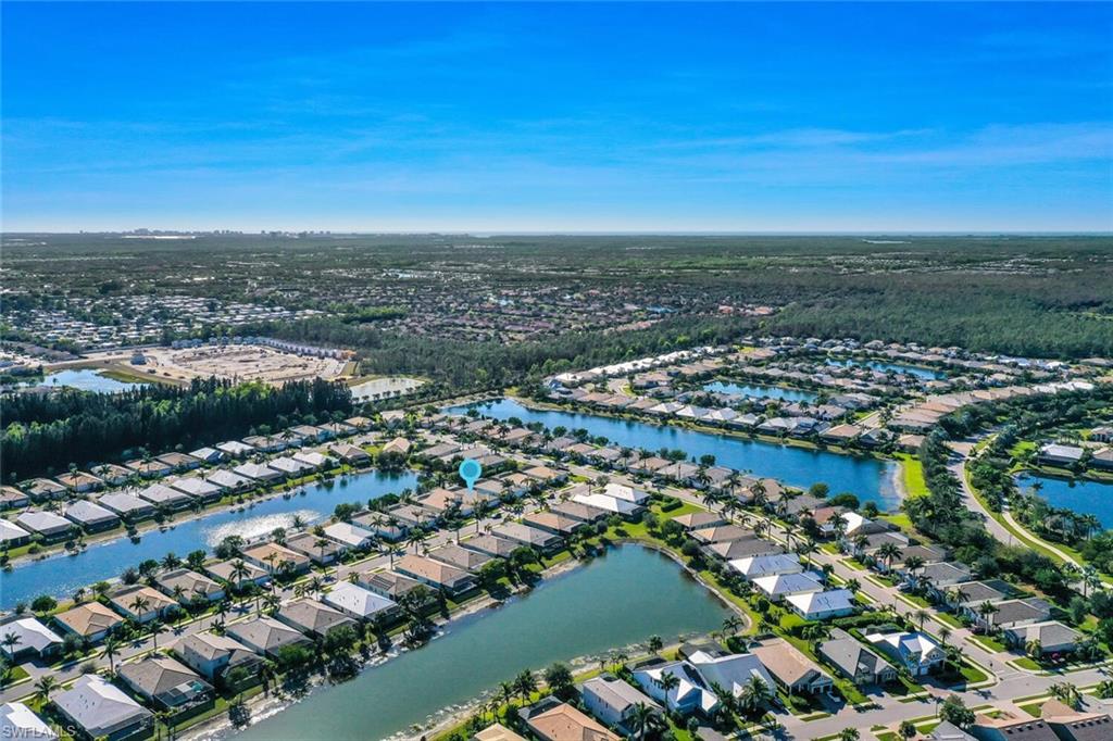 14662 Catamaran Place Naples, FL 34114 - Photo 37 of 44 an aerial view of a city with lots of residential buildings