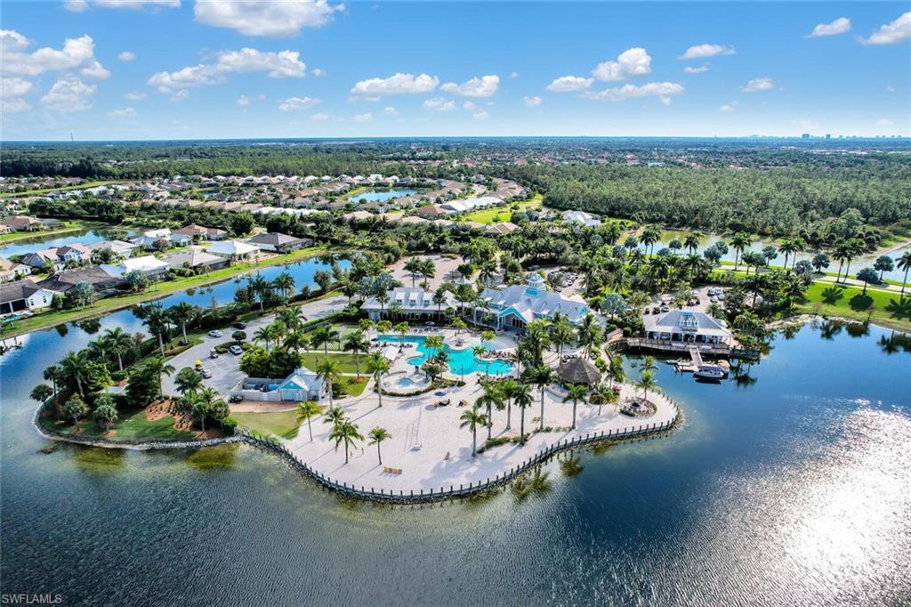 14662 Catamaran Place Naples, FL 34114 - Photo 40 of 44 a view of a lake with a nearby beach