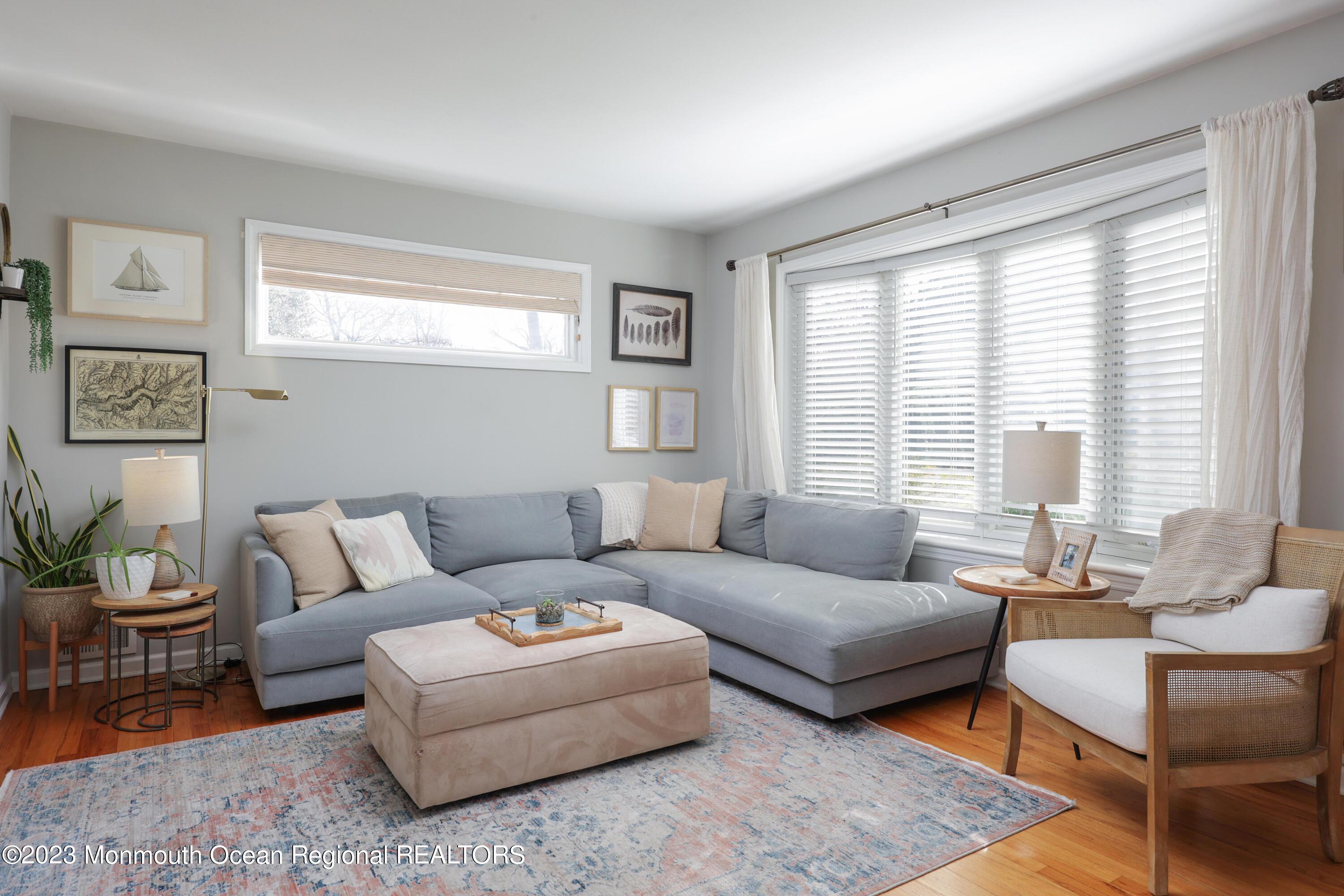 1208 Oak Road Manasquan, NJ 08736 - Photo 13 of 52 a living room with furniture and a large window