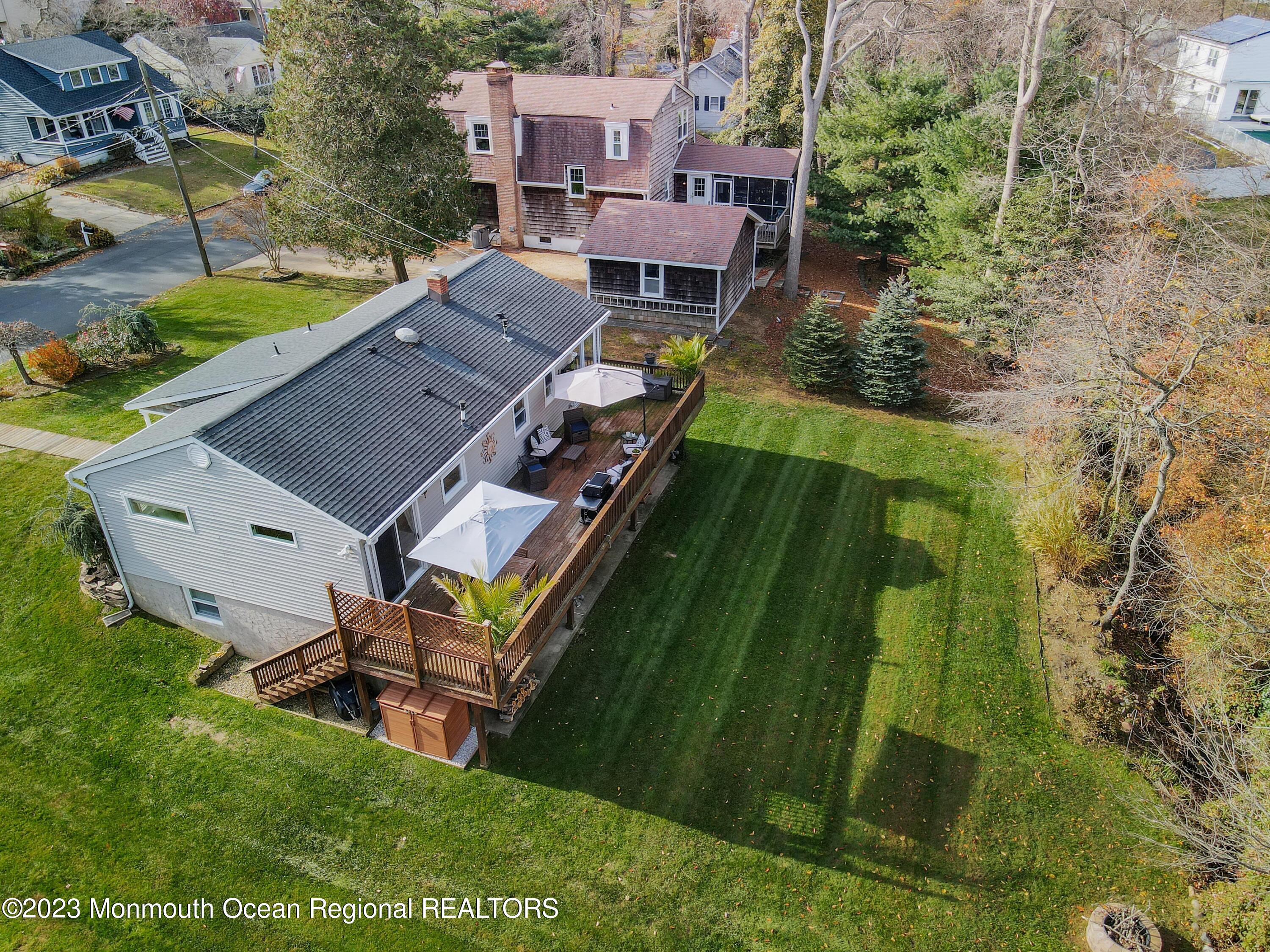 1208 Oak Road Manasquan, NJ 08736 - Photo 2 of 52 an aerial view of a house with a garden