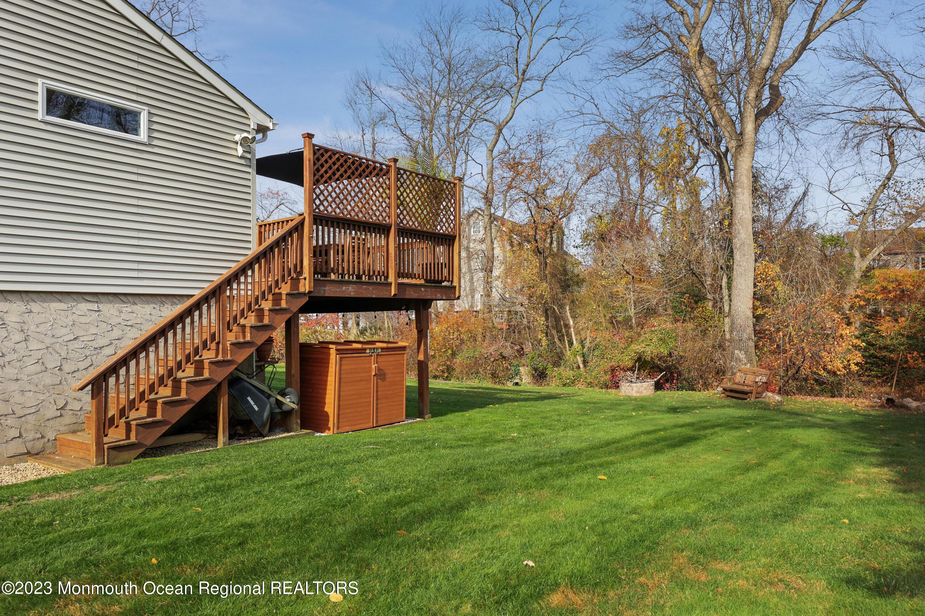 1208 Oak Road Manasquan, NJ 08736 - Photo 33 of 52 a view of a house with a yard