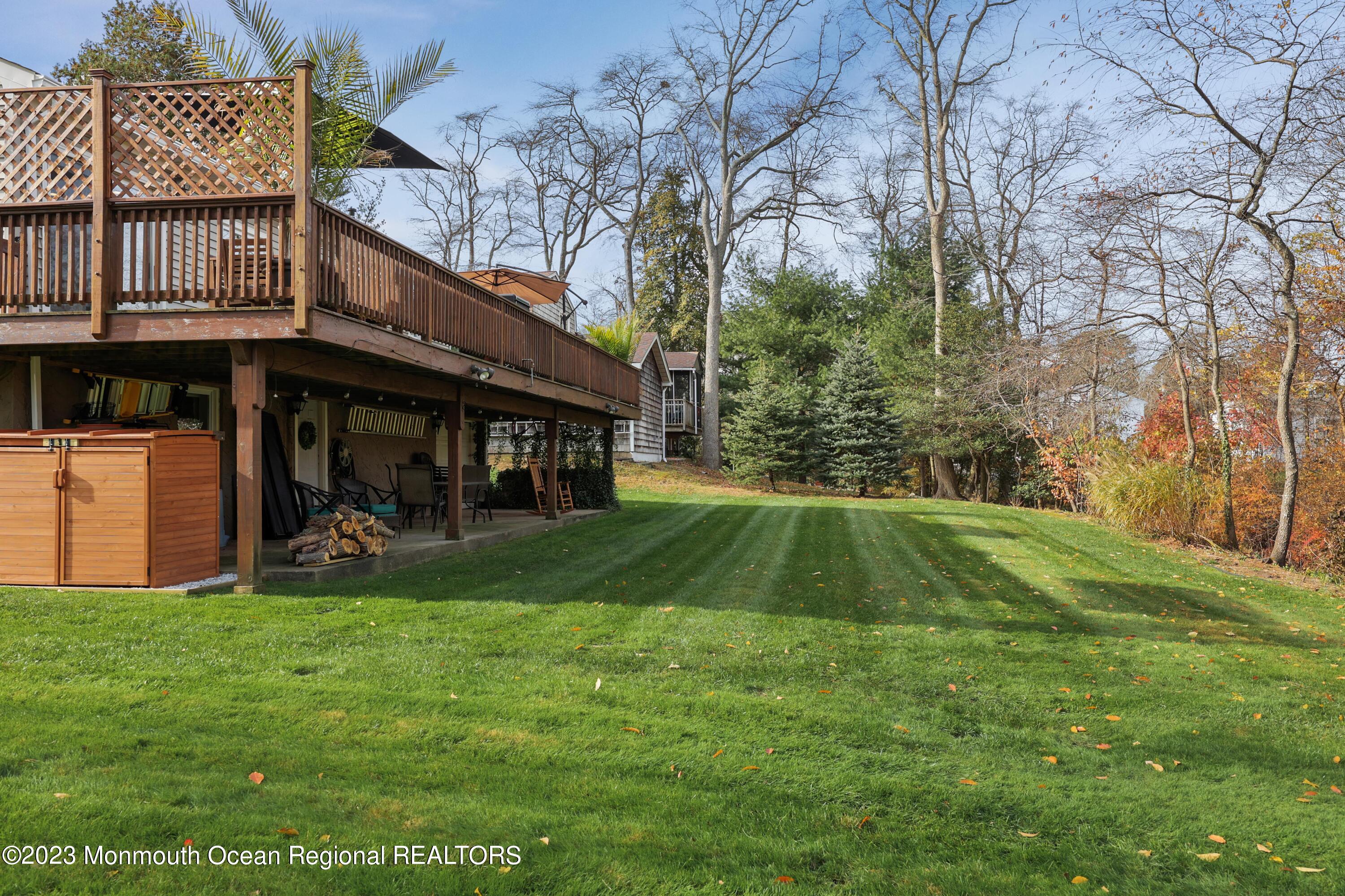 1208 Oak Road Manasquan, NJ 08736 - Photo 35 of 52 a view of a house with a yard and sitting area