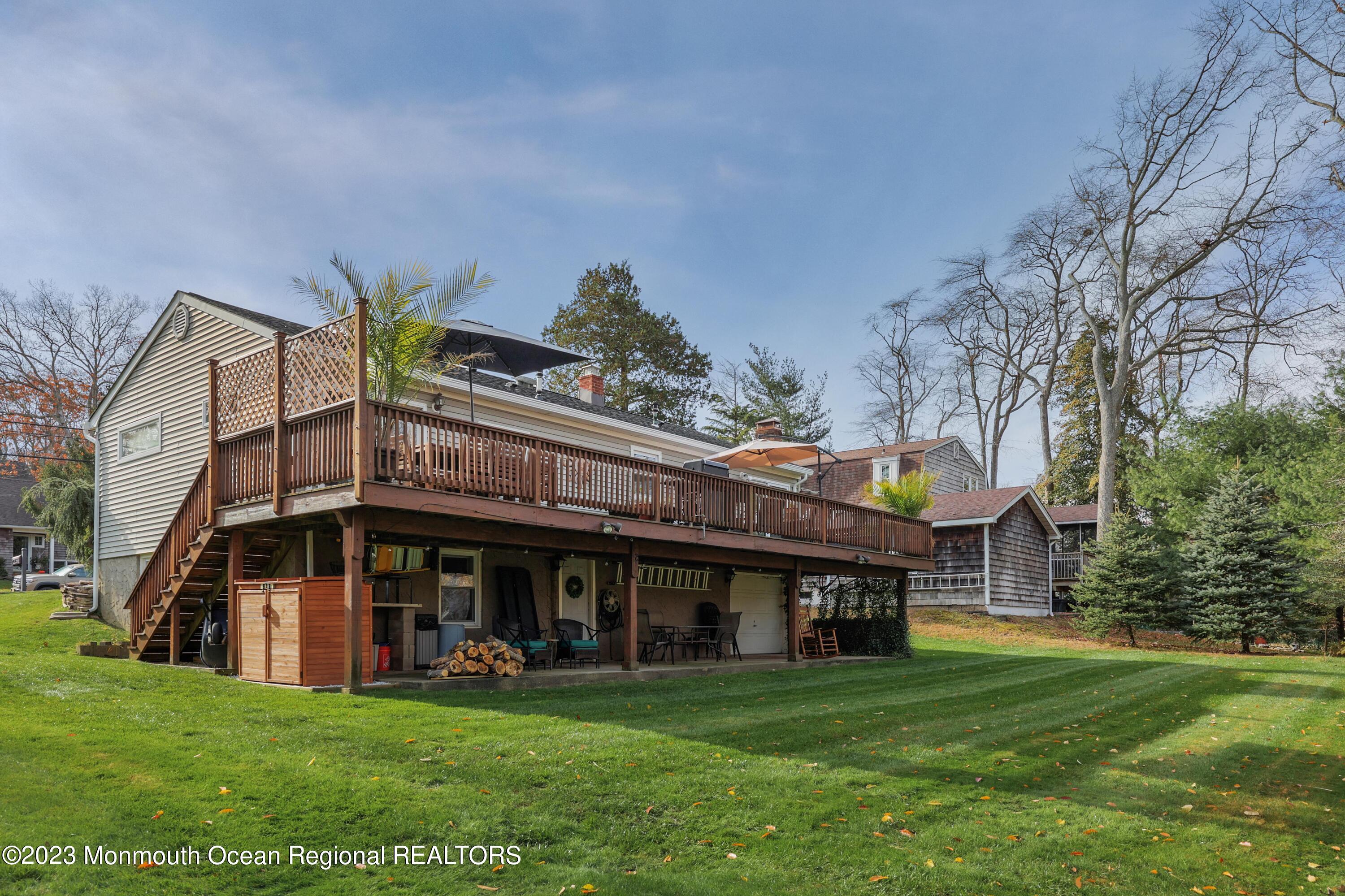 1208 Oak Road Manasquan, NJ 08736 - Photo 36 of 52 a man standing with a big yard