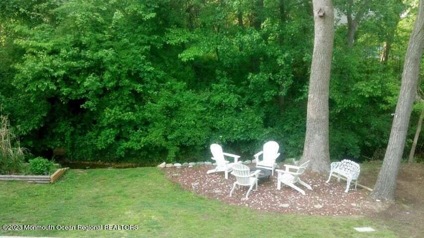 1208 Oak Road Manasquan, NJ 08736 - Photo 42 of 52 a view of a table and chairs in the garden