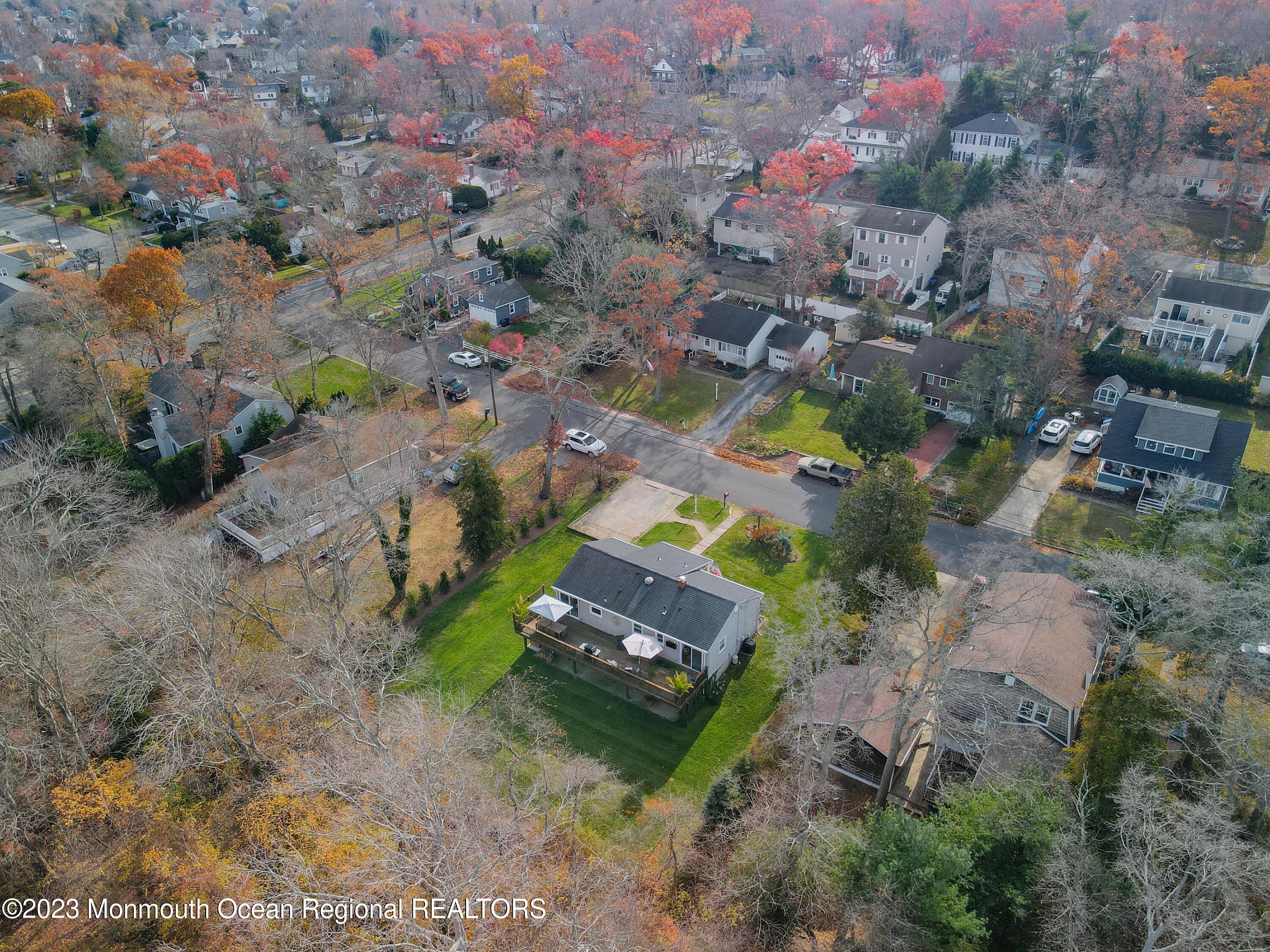 1208 Oak Road Manasquan, NJ 08736 - Photo 45 of 52 an aerial view of a house with a yard and lake view