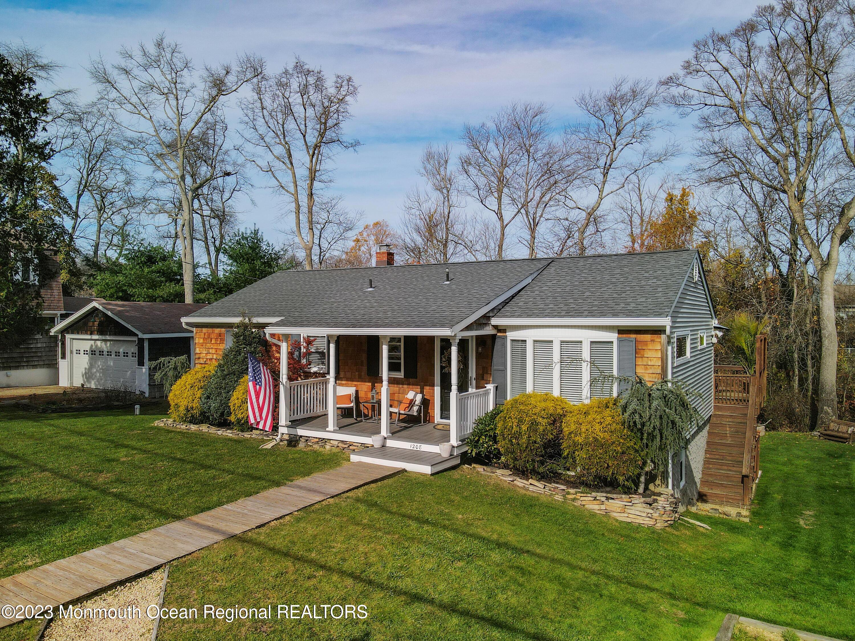 1208 Oak Road Manasquan, NJ 08736 - Photo 6 of 52 front view of a house with a yard