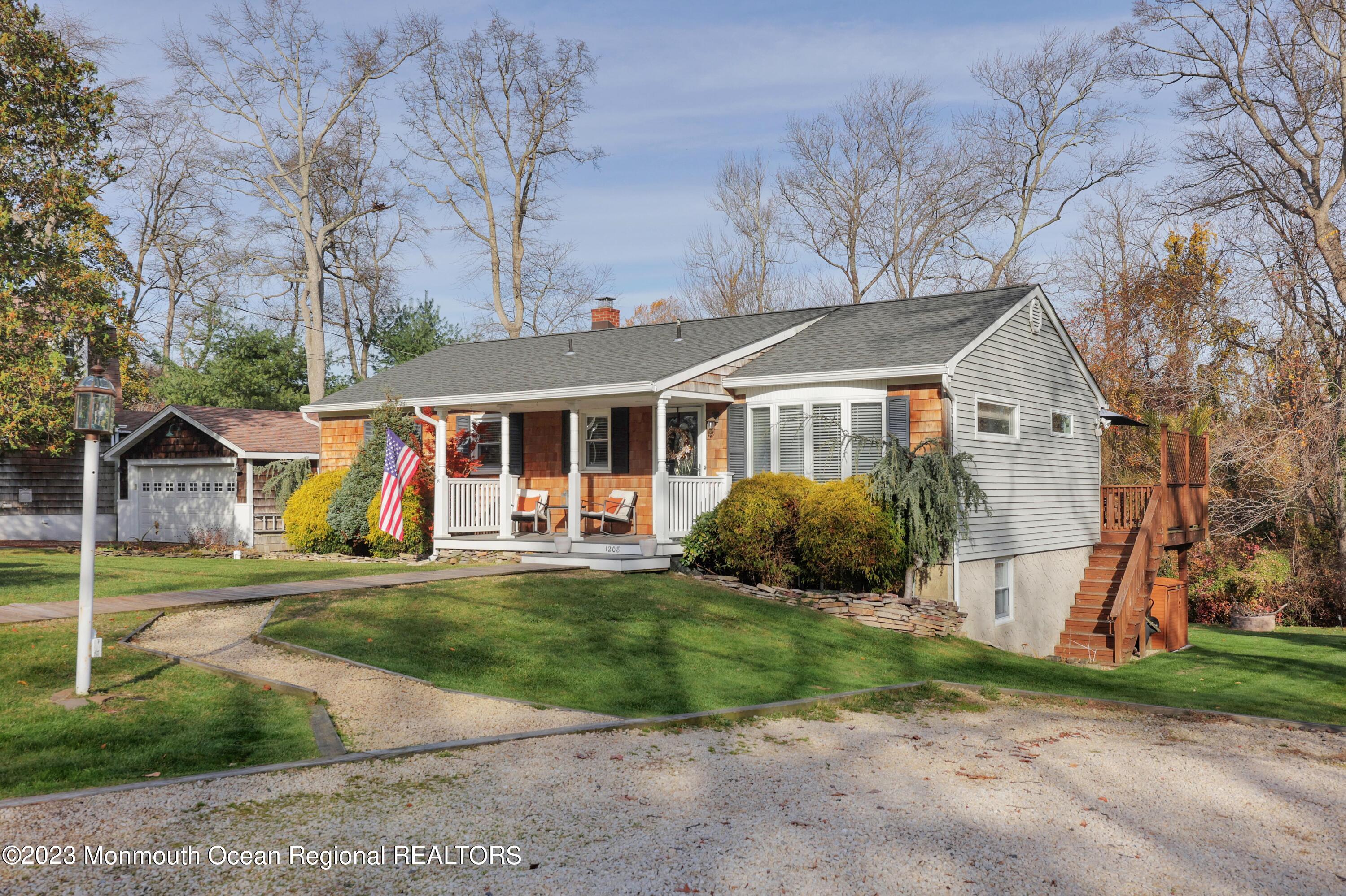 1208 Oak Road Manasquan, NJ 08736 - Photo 7 of 52 front view of a house with a yard