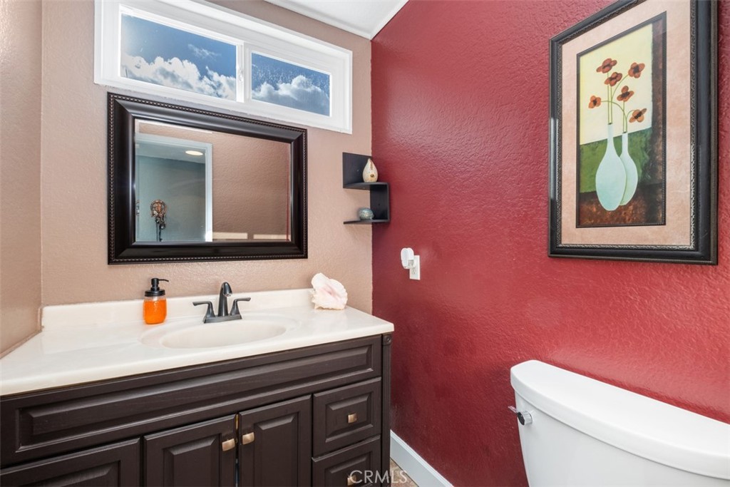 4 Firethorn Rancho Santa Margarita, CA 92688 - Photo 14 of 27 a bathroom with a toilet sink and mirror