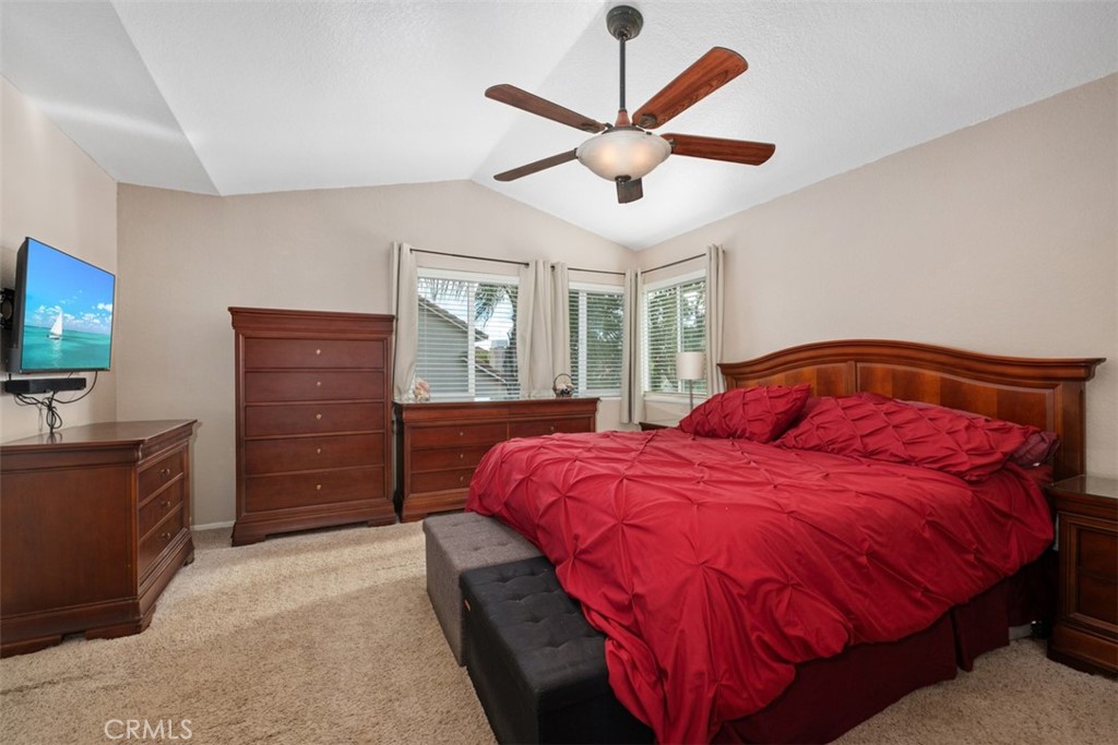 4 Firethorn Rancho Santa Margarita, CA 92688 - Photo 15 of 27 a bedroom with a bed and wooden floor