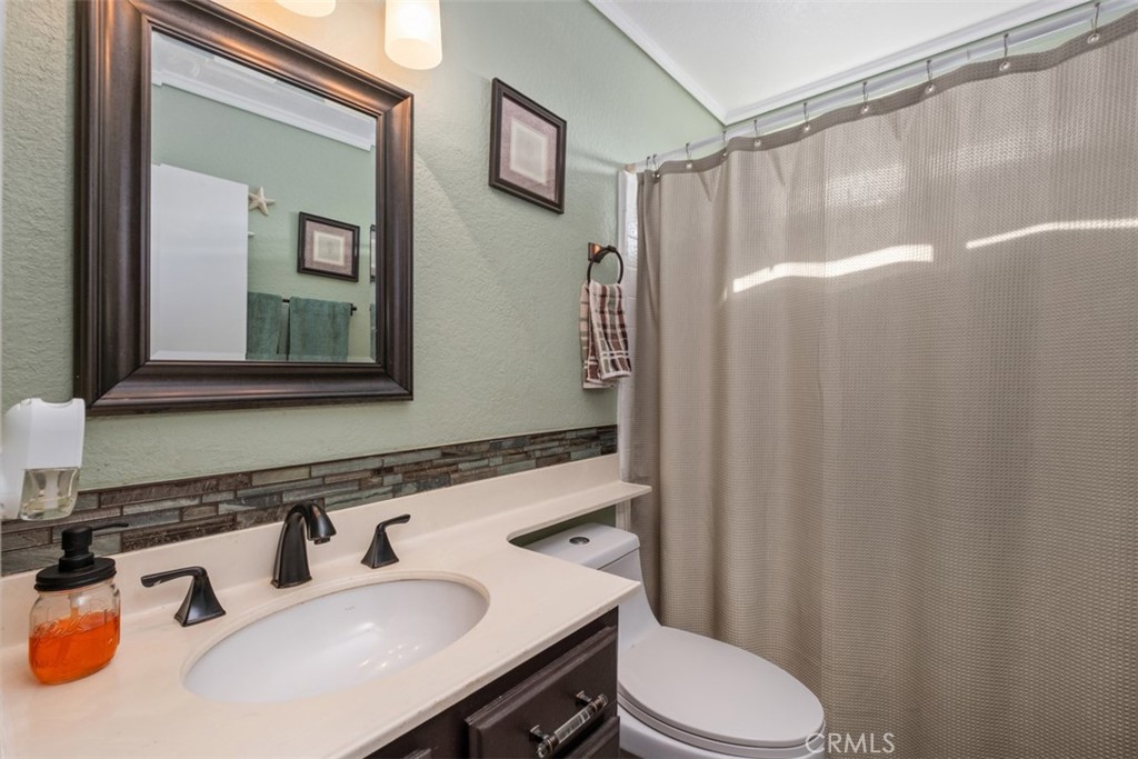 4 Firethorn Rancho Santa Margarita, CA 92688 - Photo 20 of 27 a bathroom with a sink vanity mirror and toilet