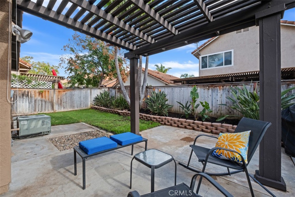 4 Firethorn Rancho Santa Margarita, CA 92688 - Photo 21 of 27 a view of a chair and table in backyard of the house