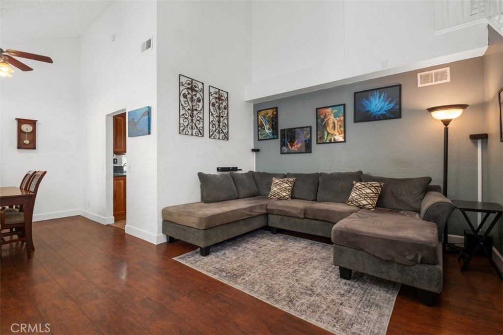 4 Firethorn Rancho Santa Margarita, CA 92688 - Photo 5 of 27 a living room with furniture and a wooden floor