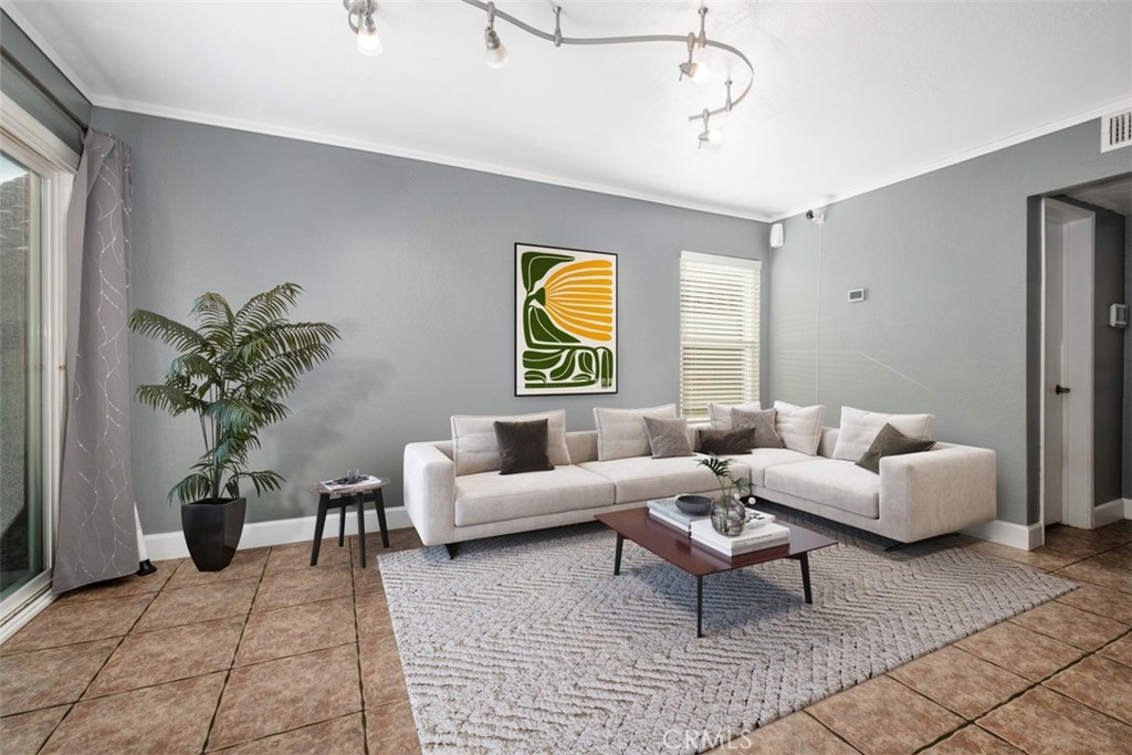4 Firethorn Rancho Santa Margarita, CA 92688 - Photo 10 of 27 a living room with furniture potted plant and window