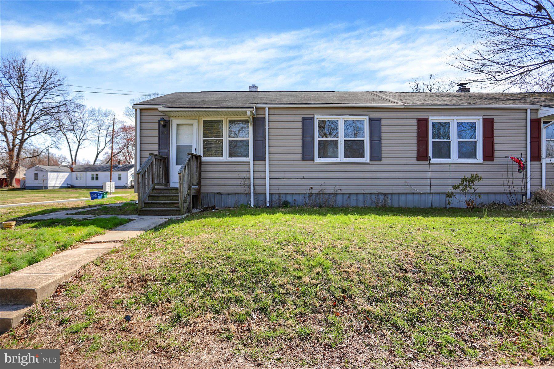 front view of a house with a yard