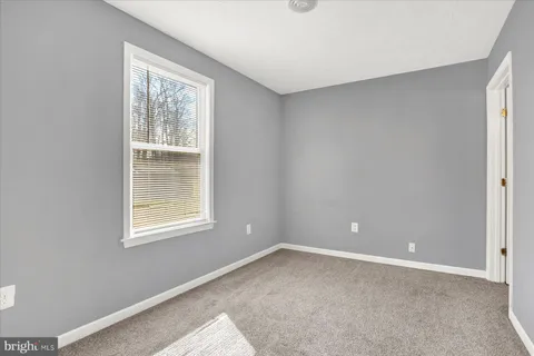 a view of a room with a window